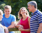 A happy family with teenage children.