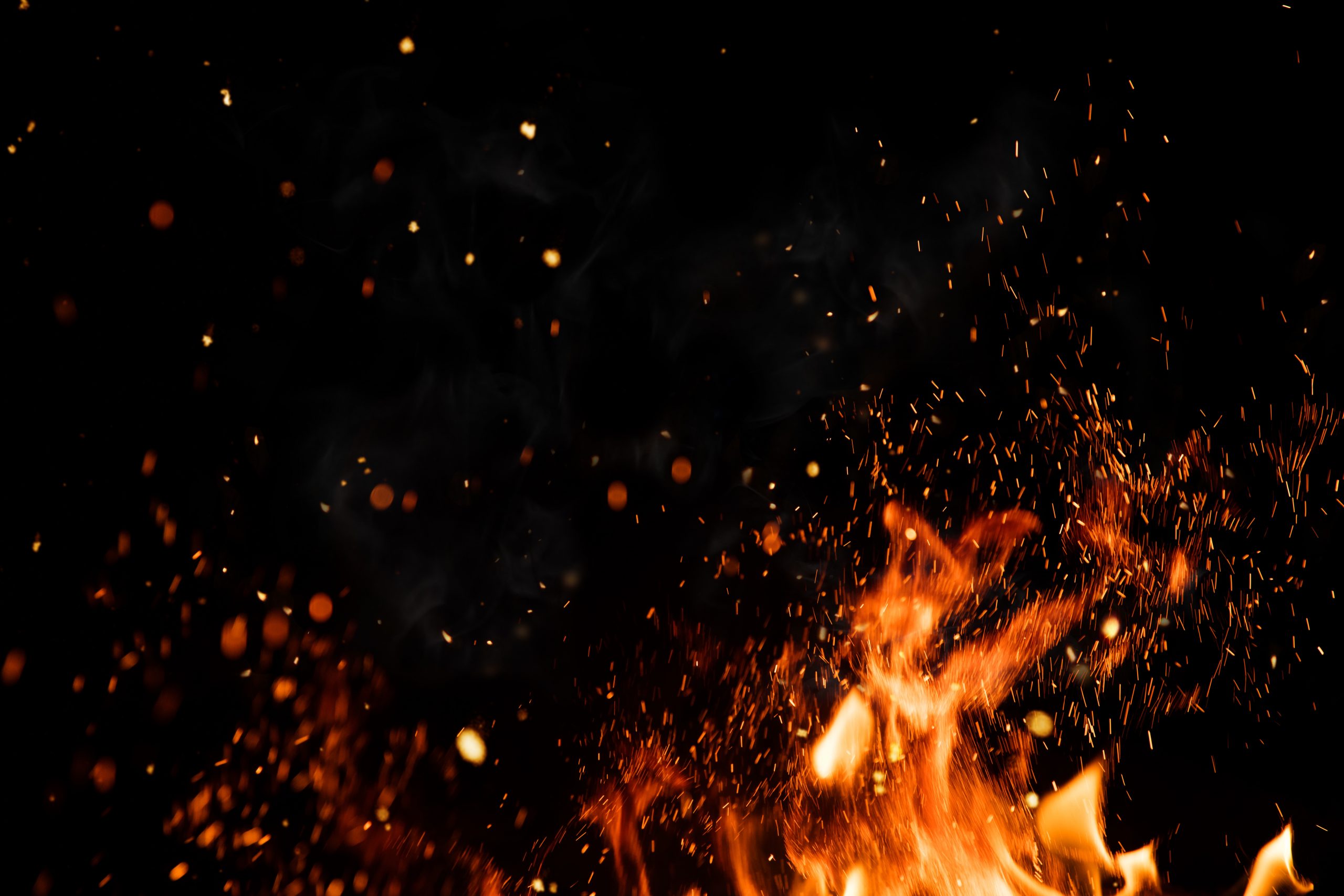 Detail of fire sparks isolated on black background