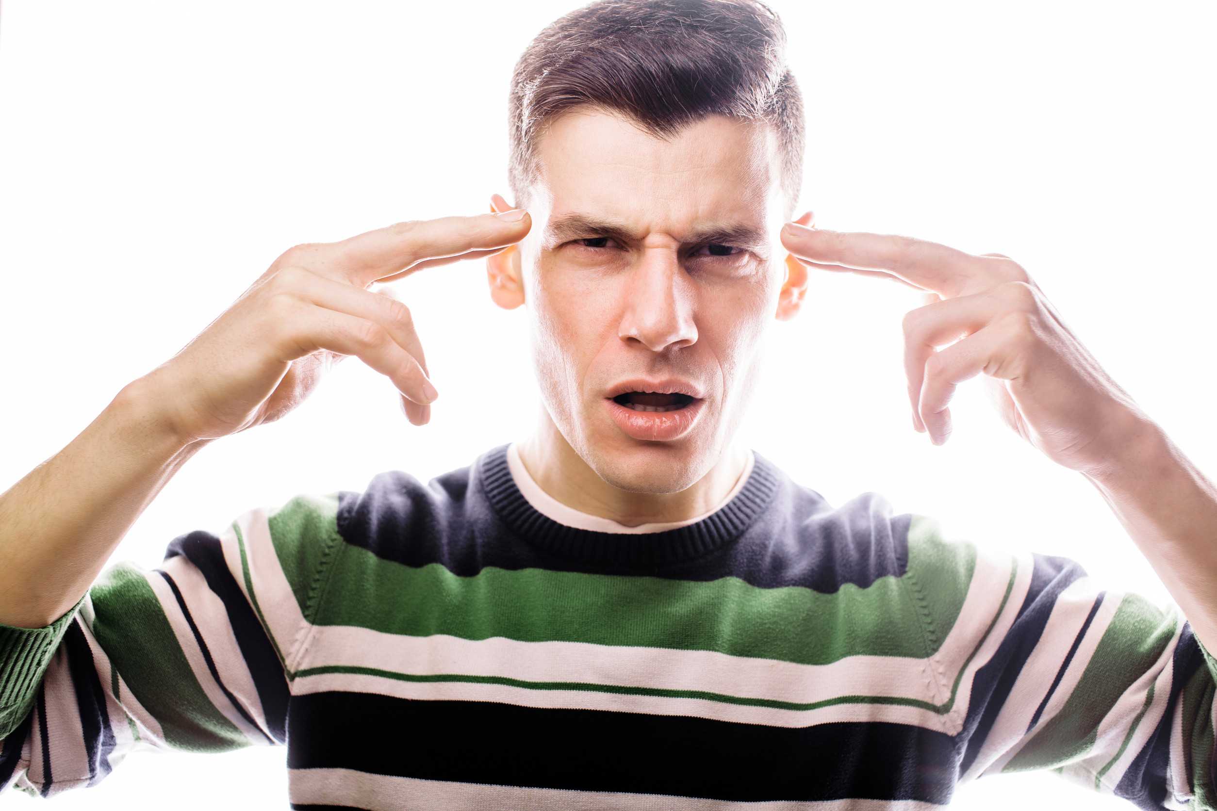 An image of a young man standing against a white background.