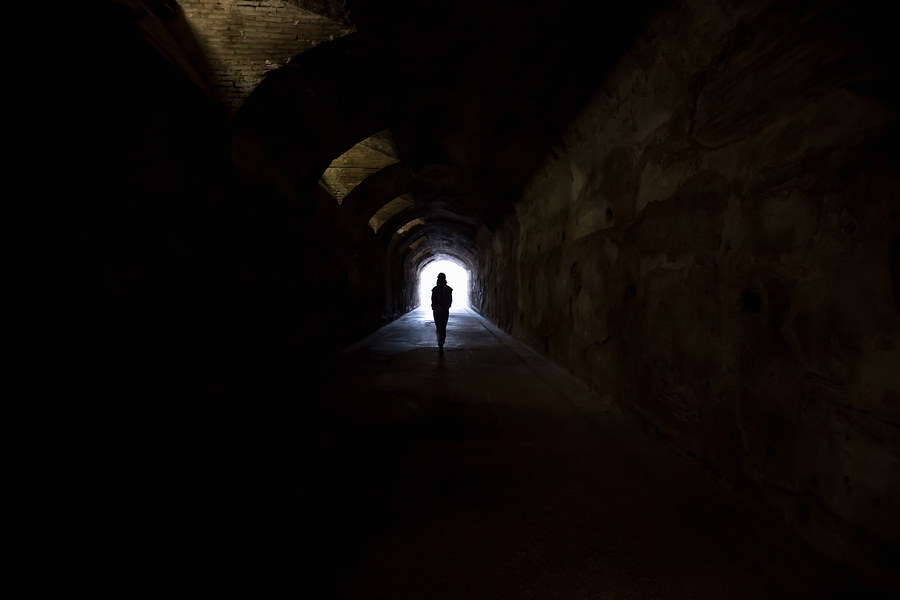 Figure In Dark Tunnel