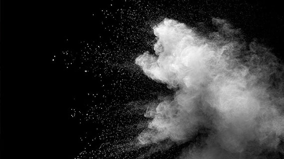 Explosion Of White Dust On Black Background