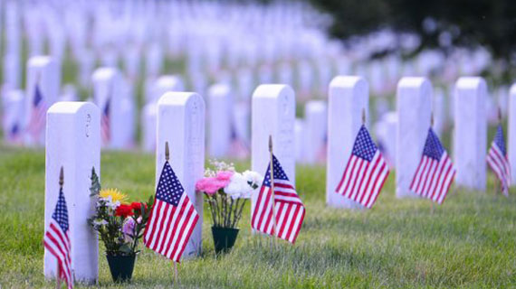 Arlington National Cemetery with a flag next to each headstone during Memorial day