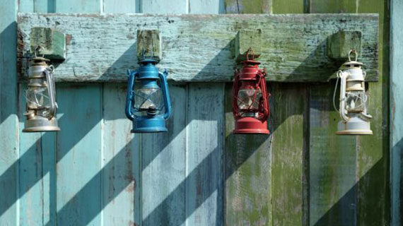 Lanterns With Different Colors Hanging On The Old Wood