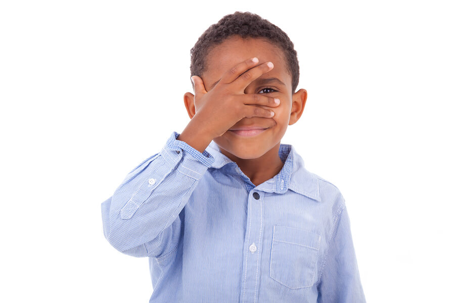 African American Boy Hiding Eyes