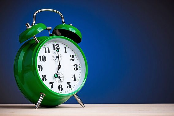 bigstock-Big-green-alarm-clock-on-dark-448816