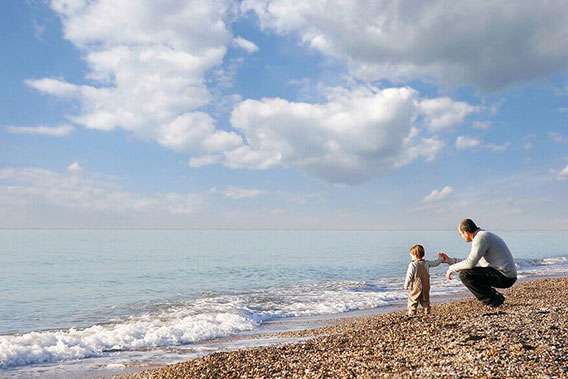 bigstock-Father-And-Son-On-Pebble-Beach-446