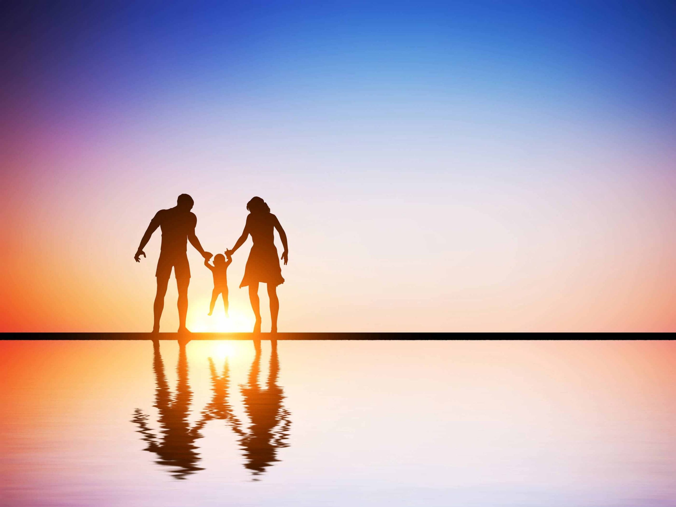 Happy family together, parents and their child at sunset, water